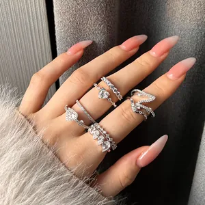 Detailed macro view showing the exquisite S925 sterling silver heart-shaped stack rings