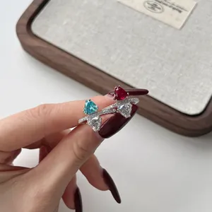 Detail shot of luxury S925 silver rings with heart-shaped ice flower cut stones.