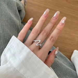 Elegant S925 sterling silver zigzag pavé ring worn on finger with natural light