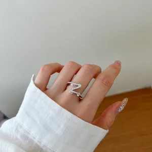 Elegant S925 sterling silver Z-shaped wrap ring featuring pavé set cubic zirconia stones