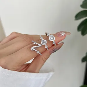 Detail showing three S925 sterling silver rings with heart and clover cubic zirconia