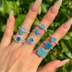 Luxury S925 sterling silver rings featuring vibrant blue ice-cut cubic zirconia stones.