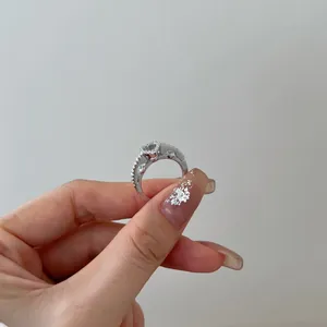 Detailed close-up of a sterling silver ring featuring a heart-shaped zircon setting.