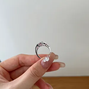 Detailed macro view of S925 sterling silver ring featuring elegant pink heart-shaped zircon stones