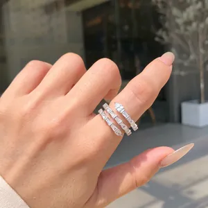 Sparkling S925 sterling silver spiral ring with baguette and pear-cut zircon stones.
