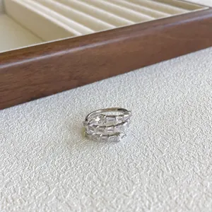 Macro view of a stackable S925 sterling silver ring set with clear cubic zirconia
