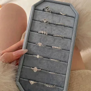 Elegant S925 sterling silver heart stacking rings displayed in a velvet jewelry tray.