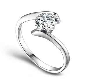Detailed close-up of a sparkling round-cut zircon set in a S925 silver cross ring.