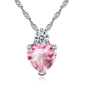 Detailed close-up view of a pink heart gemstone necklace with silver water wave chain