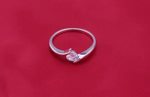 Elegant silver crossover ring featuring a brilliant zircon stone for women's wedding
