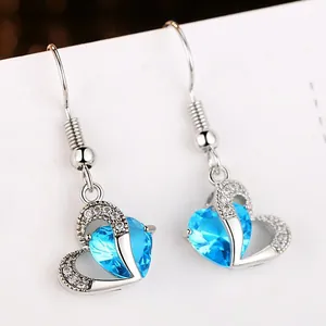 Elegant heart-shaped drop earrings with blue zircon and pavé crystal setting