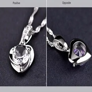 Detailed front and back view of heart-shaped pendant with clear and purple zirconia stones
