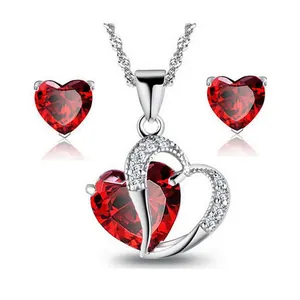 Elegant red heart zirconia jewelry set featuring a pendant necklace and matching stud earrings.