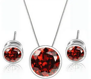 Detailed view of the elegant round red zircon necklace and matching stud earrings set