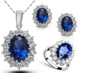 Detailed macro view of tanzanite sapphire necklace earrings and ring jewelry set
