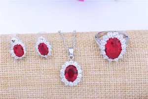 Stunning oval red ruby cluster jewelry set featuring a necklace earrings and ring