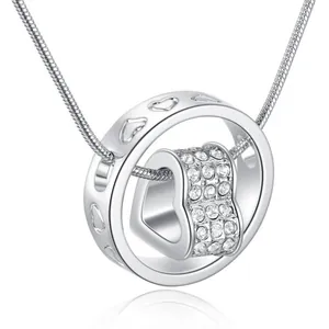 Close-up of silver spinning heart pendant necklace with shimmering crystal accents