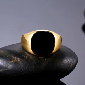 Classic gold-plated signet ring for men with black enamel inlay on natural stone