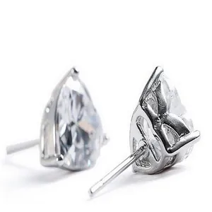 Macro view of heart-shaped cubic zirconia stud earrings in a polished silver setting