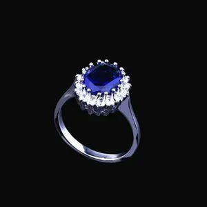 Detailed close-up of a classic Princess Kate style blue sapphire and zircon ring
