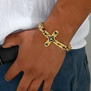 Detail shot of a men's gold stainless steel hip hop cross bracelet worn on wrist