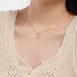 Detailed close-up of a dainty gold-plated S925 silver necklace with initial pendant