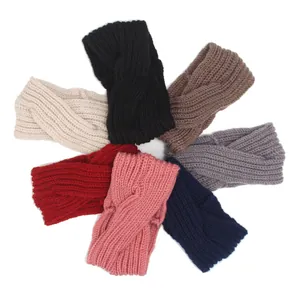 Assortment of handmade knitted cross headbands for women in multiple vibrant colors