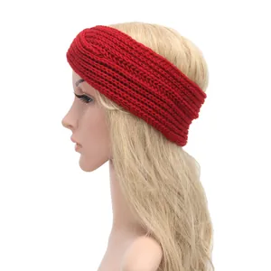 Side view of a red bohemian style hand-knitted cross woolen headband for women