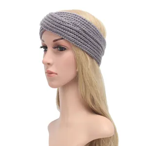 Detail showing the gray knitted texture and twist design of the bohemian headband