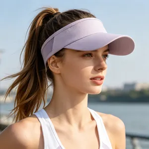 Macro detail of a model wearing a purple breathable sun visor for outdoor sports.