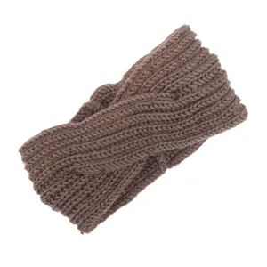 Detail view of the brown hand-knitted crossover wool headband with textured knit pattern