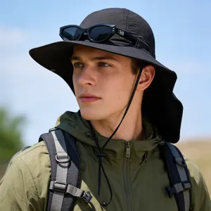 Professional close-up view of a black wide-brim sun hat with neck flap worn by a male model.