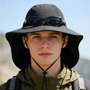 Close-up view of a black breathable wide-brim sun hat with neck flap and mesh panels.