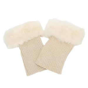 Flat lay view of knitted boot cuffs featuring white faux fur trim details.