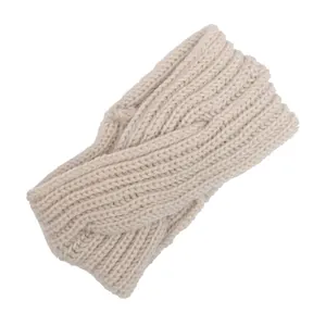 Macro detail view of a beige hand-knitted twisted cable wool headband for women.