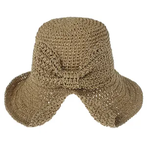 Chapeau de soleil élégant en paille tissée pour femme avec un grand nœud décoratif