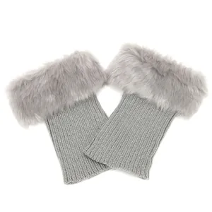 Grey knitted boot toppers with fluffy faux fur trim and textured rib knit detail.