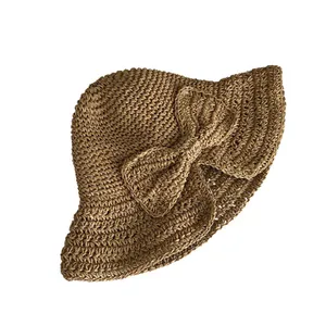 Élégant chapeau de soleil en paille tissé à la main pour femmes avec un grand nœud décoratif