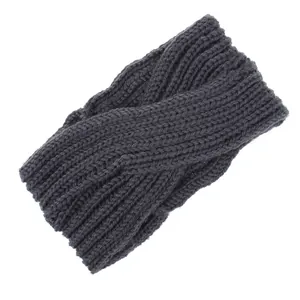 Macro detail of dark grey knitted twisted headband with intricate handmade texture