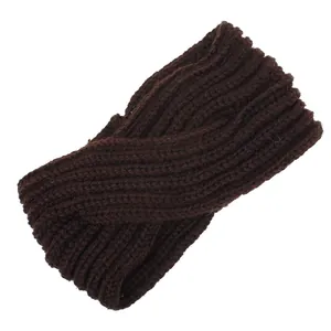 Detailed view of a brown hand-knitted twist front headband with ribbed texture
