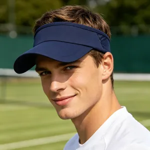 Detailed shot of a man wearing a navy blue sun visor on a sunny outdoor tennis court