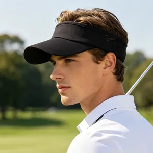 Male model wearing a black visor on a golf course for outdoor sun protection