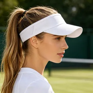 Detailed side profile view of a breathable white sports sun visor worn on a tennis court.