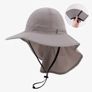 Detail view of a foldable light gray sun hat with neck flap and breathable mesh holes.