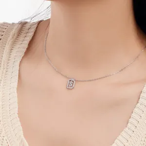 Delicate S925 sterling silver necklace with sparkling initial S pendant on model
