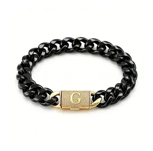 Bracciale a catena cubana in acciaio nero con chiusura a lettera G in strass dorati