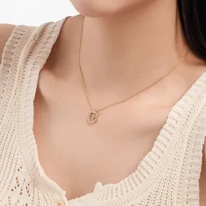 Close-up of a gold-plated S925 silver necklace with a crystal-encrusted letter P pendant
