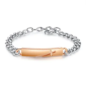 Macro view of 316L stainless steel cross bracelet with rose gold engraved ID plate