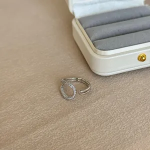 Detailed view of the S925 sterling silver irregular line open ring with stones