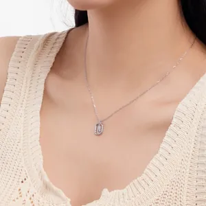 Close-up of S925 sterling silver necklace with delicate hollow letter M pendant